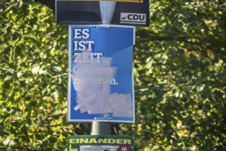 State election in Brandenburg 2024: parties canvass for votes on election posters. Graffitied