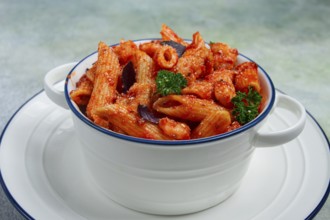 Penne pasta, with shrimp in tomato sauce, close-up, no people