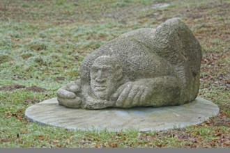 Sculpture Finding by Laura Danzi 2018, stone sculpture, thick, rough, surface, lying, head, face,