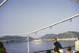 Boat approaching thought to be Korcula, Dalmatian Coast, Croatia, former Yugoslavia, Europe 1970,