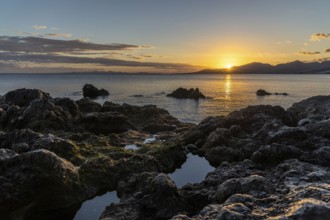 Rocky coast at sunset with calm sea, Canary Islands, Lanzarote, Spain, Europe