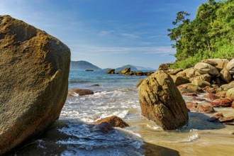 Rocks, sea, forest and hills surrounding the paradisiacal beach of Indaiatuba in Ilhabela Ilhabela,