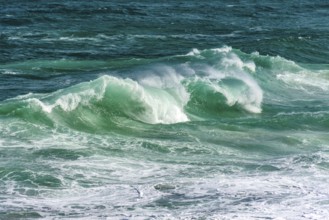 Waves breaking on Ipanema beach on a sunny summer day and the sea with greenish waters, Ipanema