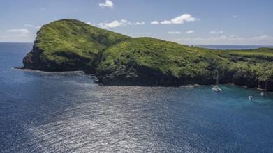 Bird's eye view Aerial view of cape high cliffs steeply rising rocks of Isle de Coin de Mire,