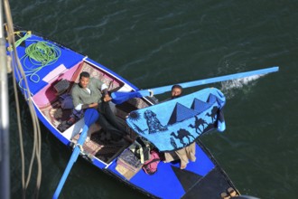 Souvenir dealer with a rowing boat on the Nile, Egypt, Africa