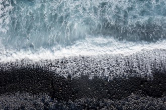 Waves on the beach, turquoise sea and black pebble beach, aerial view, La Gomera, Canary Islands,