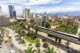 Medellin skyline with a train of the Metro de Medellín at Plaza Botero in Medellin, Colombia, South