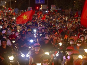 Football fans celebrate in the streets, victory in Asean championship against Thailand, many