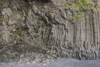 Reynisfjara Beach with Basalt rocks (Stuolabrrg) and the rock needles (Haidrangur), close to Vik i