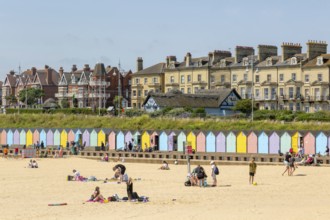 People enjoying sunny weather on sandy South Beach, Lowestoft, Suffolk, England, UK