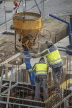 Construction site, concreting, the lift shaft of a building is concreted, the concrete is placed on