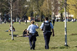 Police patrol monitors the contact ban, Rheinpark, Düsseldorf on the Rhine during the corona