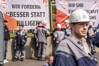 Steelworkers at a demonstration in front of the headquarters of ThyssenKrupp Steel Europe in