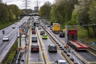 Weighing and barrier system on the A42 motorway, in front of the dilapidated motorway bridge over