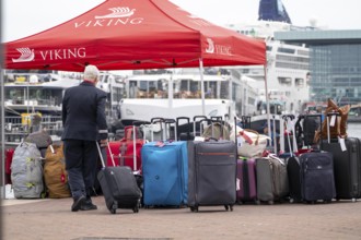 Luggage waiting to be loaded onto river cruise ships at Viking Cruise Port Amsterdam, Netherlands