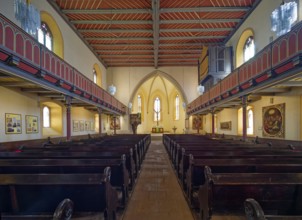 Late Gothic Protestant-Lutheran town church of St Peter with pulpit, altar, crucifix and baptismal