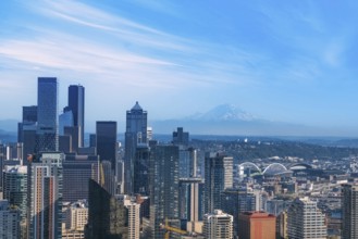 Panoramic Seattle financial district skyline in city downtown with Mount Rainier in the background