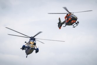 A Sea King MK41 multi-purpose helicopter and an H145 search and rescue helicopter, photographed as