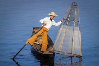 Myanmar travel attraction landmark, Traditional Burmese fisherman with fishing net at Inle lake in