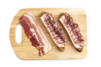 Bread sandwiches with jerky salted meat and lard with beet microgreen isolated on white background.