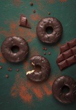 Donuts with cocoa, in chocolate glaze, top view, no people