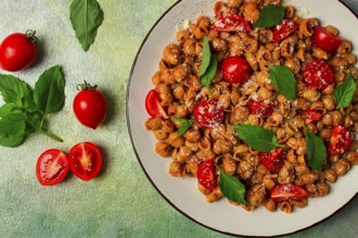 Tuscan pasta with smoked paprika and basil, parmesan cheese, Italian traditional cuisine