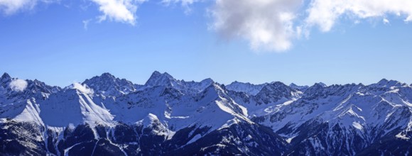 Alpine panorama with snow-covered mountain peaks in winter. Taken in the ski resort of Serfaus Fiss