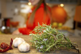 Vegan cooking: Close-up of rosemary, garlic cloves and chilli peppers