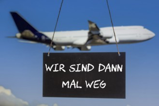 Symbolic image company holidays: Sign with the inscription WIR SIND DANN MAL WEG in front of an