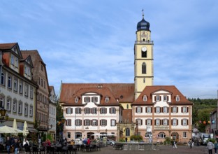 The twin houses built in the early classicist style with church tower on the market square in the