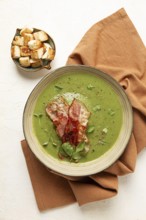 Green mashed soup, with bacon and croutons, homemade, no people