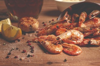 Fried shrimp in a paper bag, shrimp for beer, in a newspaper, on a wooden table, no people