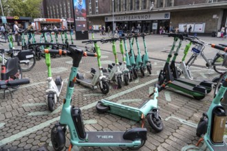 Designated sharing stations, parking space for e-scooters, rental bikes, e-scooters, in front of