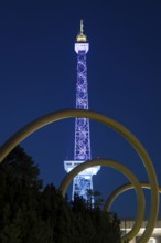 The radio tower shines in the colours of the IFA (Internationale Funkausstellung) on the exhibition