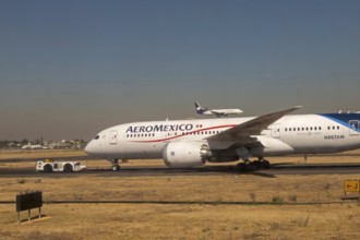 Mexico City, An AeroMexico Boeing 787-8 Dreamliner sits on the tarmac while another AeroMexico