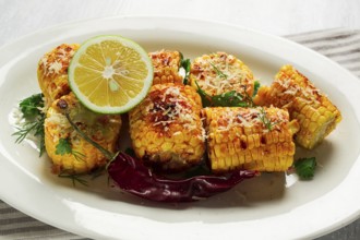 Grilled corn with spices, top view, no people, homemade