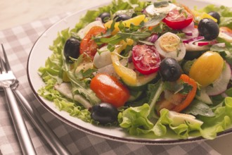 Vegetable salad, with quail eggs and olives, fresh, close-up, no people