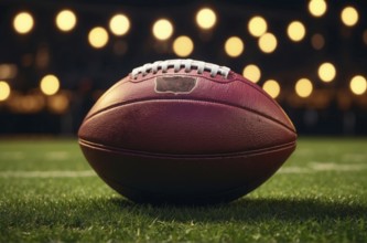 A football is on the field with lights in the background, AI generated