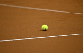 Tennis ball lying on the ground, clay, logo, Roland-Garros, tennis, Porsche Cup 2024, Porsche