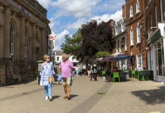 People shopping in pedestrianised street in town centre, Beccles, Suffolk, England, UK