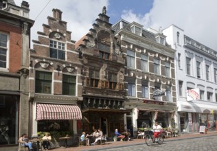 People sitting outdoors cafe tables Visstraat, Dordrecht, Netherlands