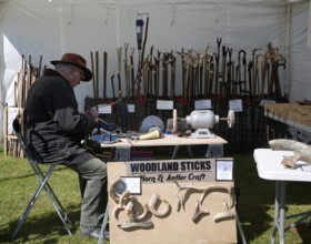 Man demonstrating horn and antler craft Mid and West Suffolk show, Stonham Barns, Suffolk, England,