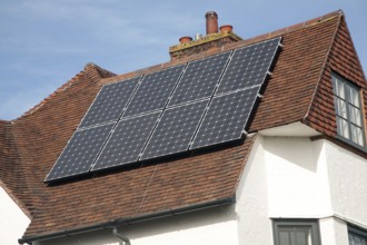 Photovoltaic solar panels on roof, England, UK