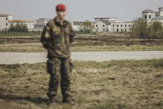 A soldier stands out in front of the training town, taken as part of a Bundeswehr exercise with