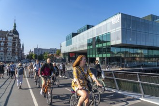 Cyclists on the Lille Langebro cycle and pedestrian bridge over the harbour, Copenhagen is