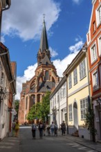 The old town of Lüneburg, view over the Lüner Straße to the St. Nicolai Church, Lower Saxony,