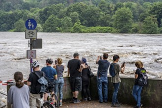 Weir of the Lake Baldeney in Essen, the masses of water roar through the open weirs, spectators,