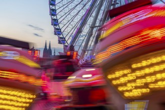 Deutz funfair on the Rhine, at Easter, funfair, break-dancer ride, Ferris wheel, Cologne Cathedral,