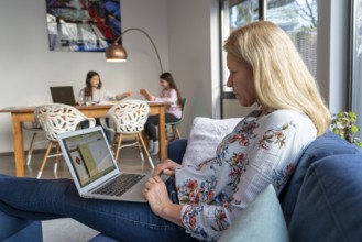 Homeschooling, during the lockdown in January 2021, children learning at home for school, a girl in