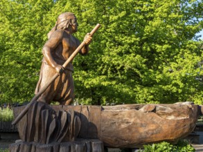 Wooden sculpture of man in a boat, central plaza, plaza de armas, Pucon, La Auracania, Chile, South